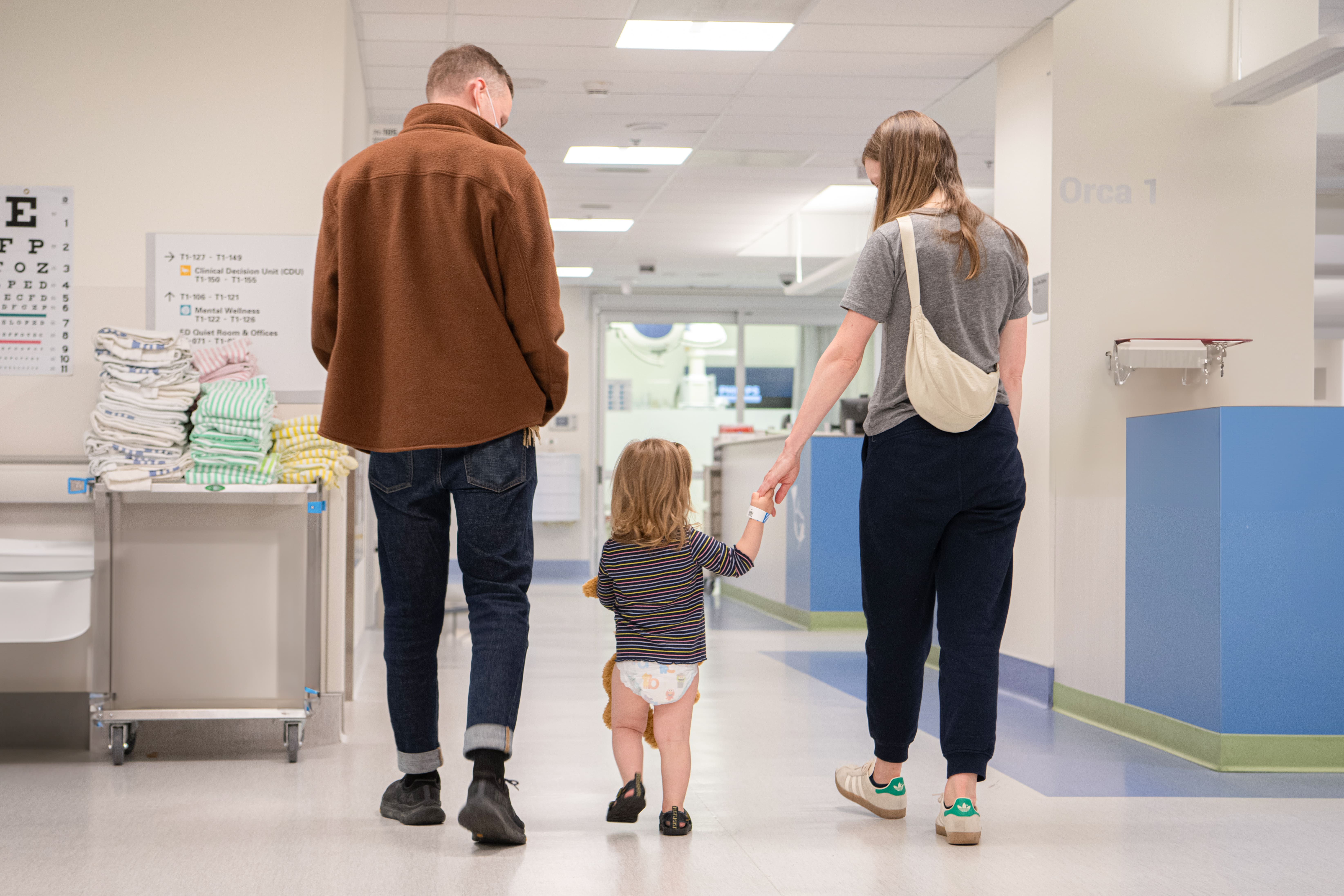 an image of a man, a kid, and a women in the PICU